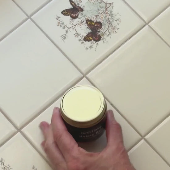 overview video of someone opening a jar of Mojave Rain tallow balm, scooping it out, and rubbing it in skin
