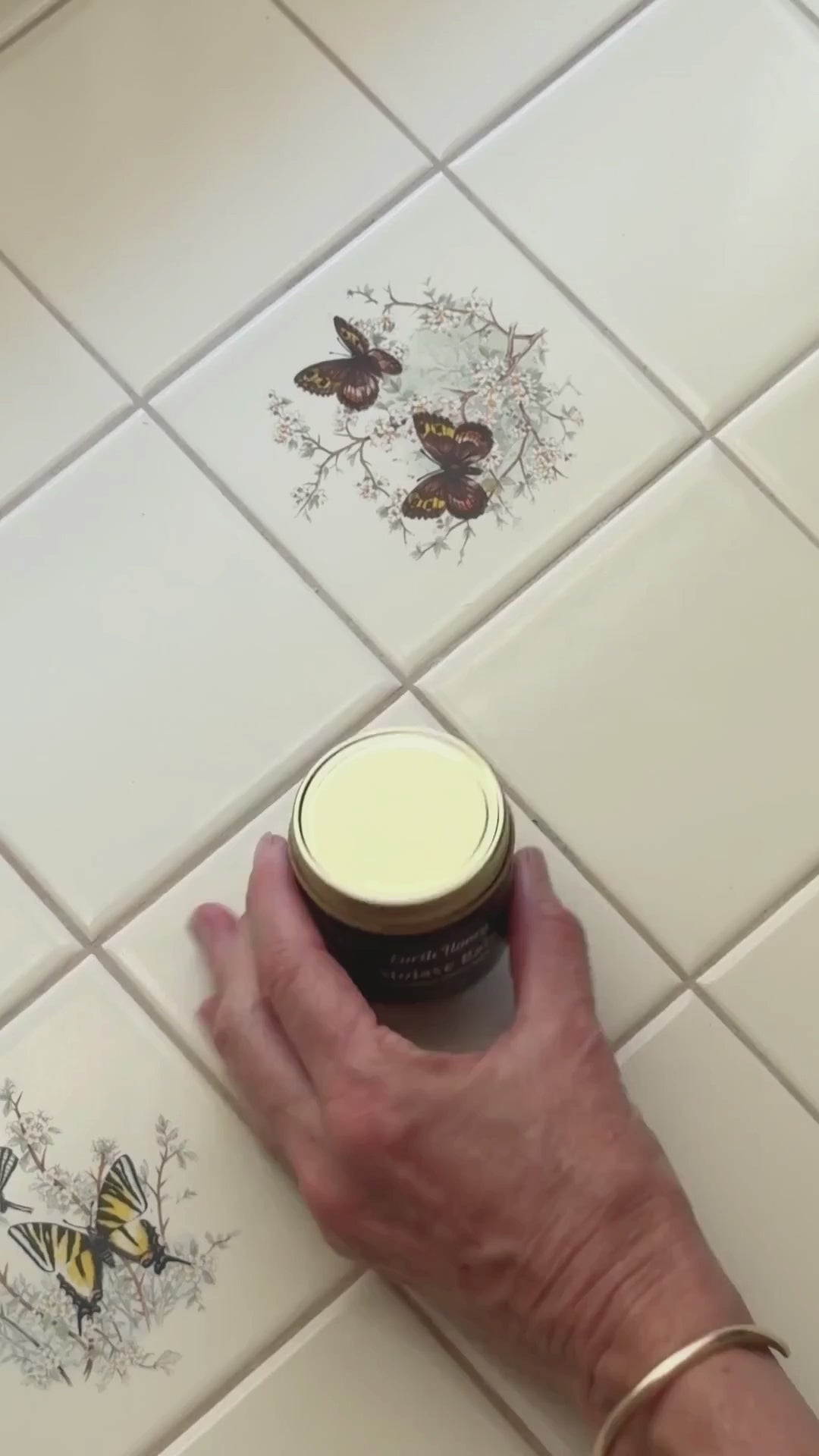 overview video of someone opening a jar of Mojave Rain tallow balm, scooping it out, and rubbing it in skin